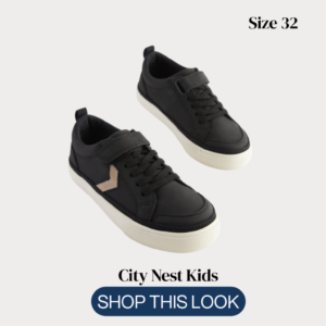Original NEXT kids black trainers size 32 on light biege background
